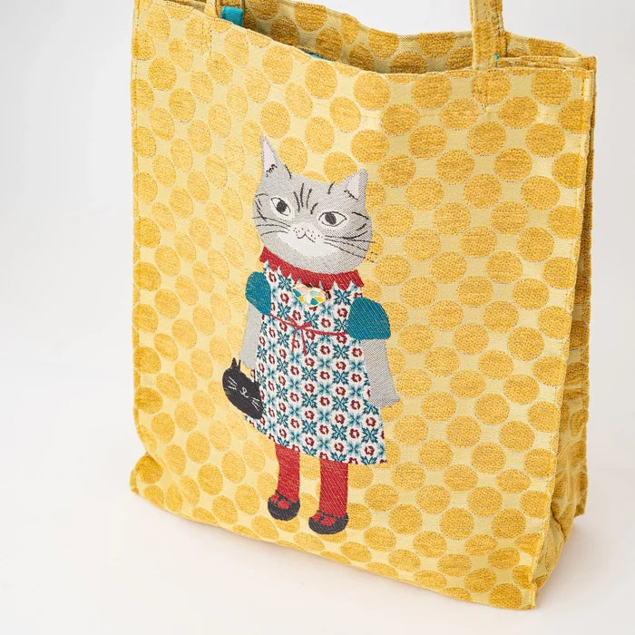 Yellow polka dot tote bag with a cat design on a white background